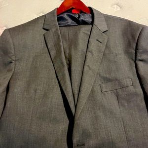 Dark gray suit. Modern cut